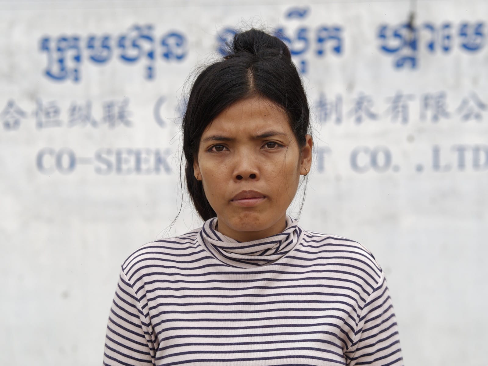 Cambodian Garment Worker Protesting Unpaid Wages