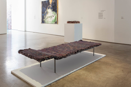 Gallery view of Chevalier Masson's Tapa Daybed at the Textiles Revealed exhibition. (Photo Courtesy of Belgium is Design)
